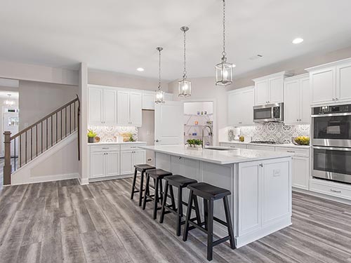 The spacious and open kitchen of the Emerson homeplan at Echols Farm>